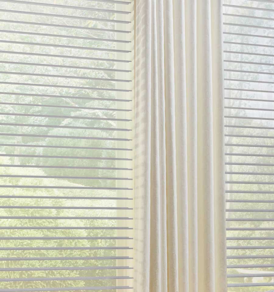 close up of sheer shades with custom drapery off white