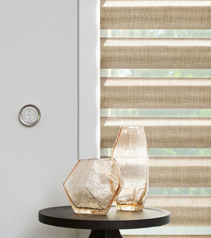 wall-mounted remote for easy to adjust motorized window treatmentsPirouette Window Shades timan and co