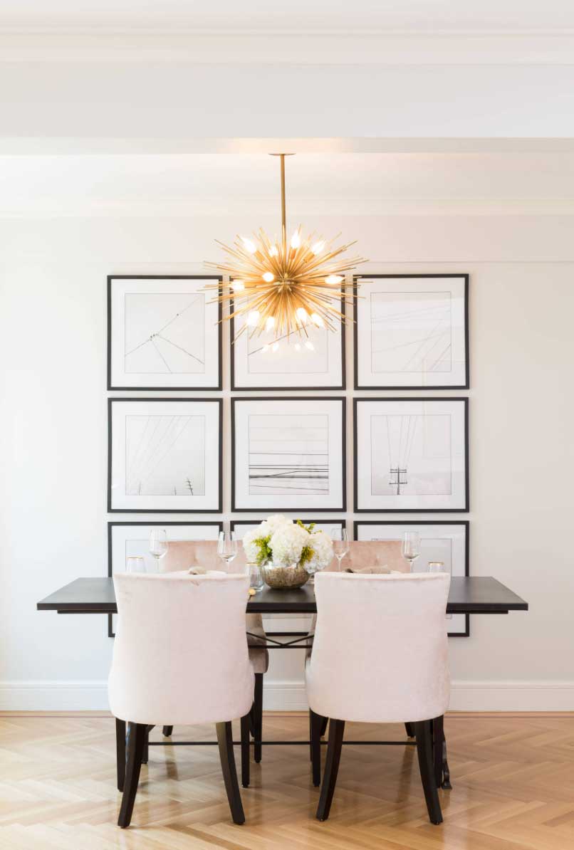 minimalist dining space with bold light fixture
