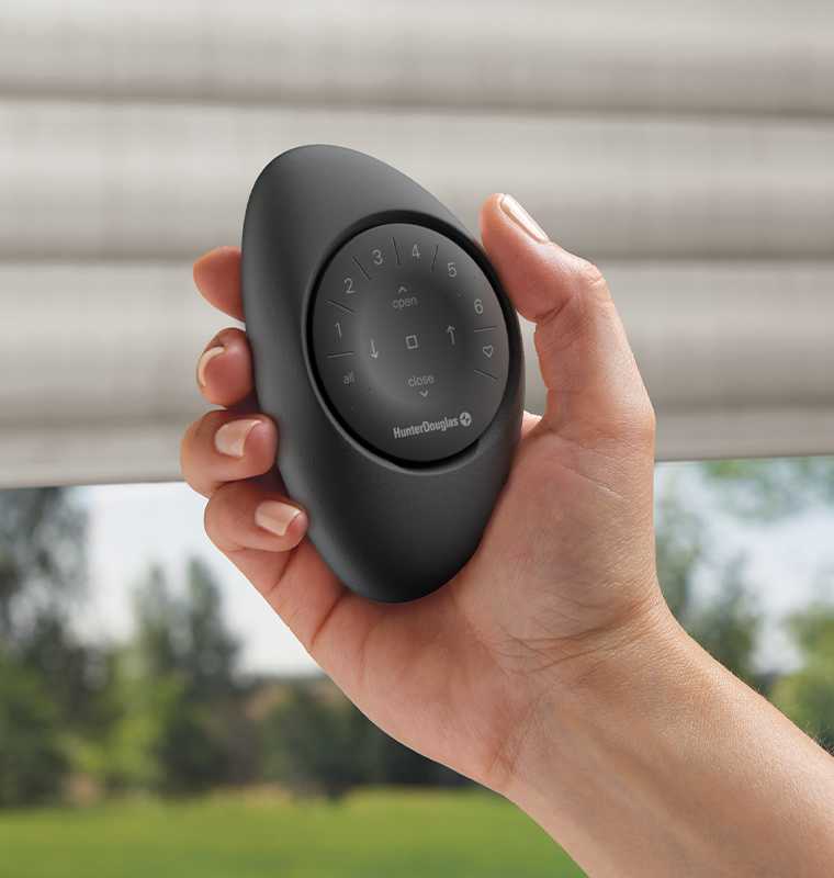 powerview-pebble-remote-in-white-and-black-hunter-douglas-timan-window-treatments