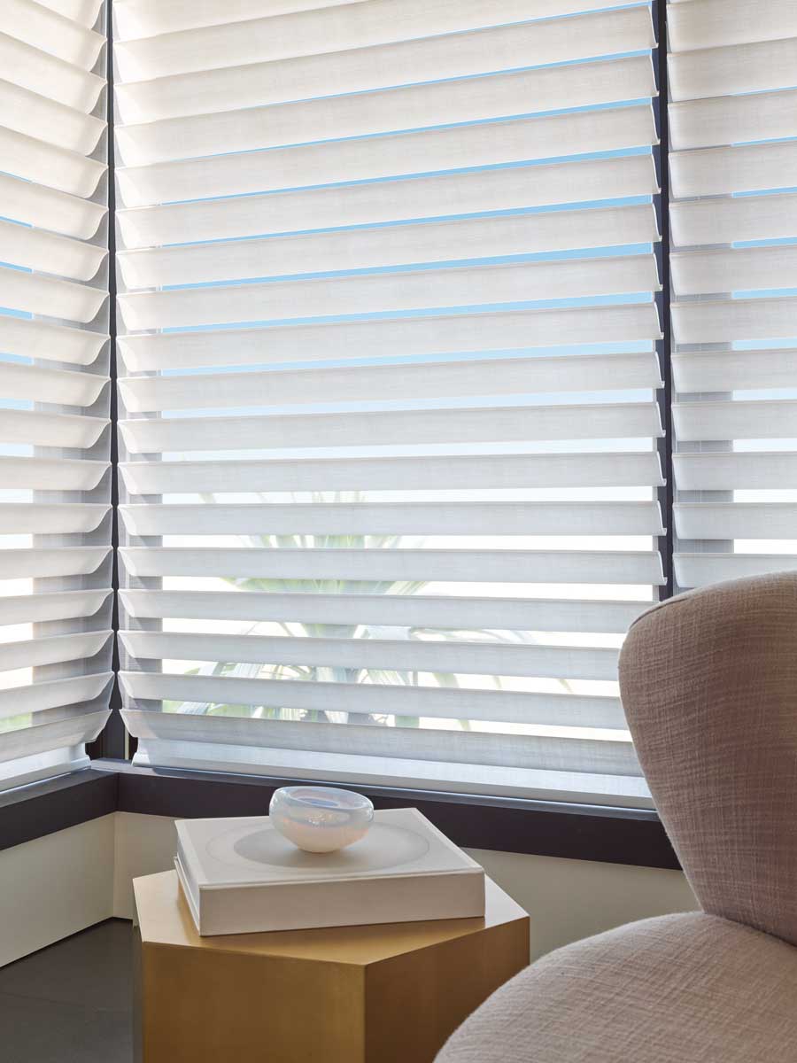silhouette shades that adjust with vanes pointing up at the ceiling for lighting control