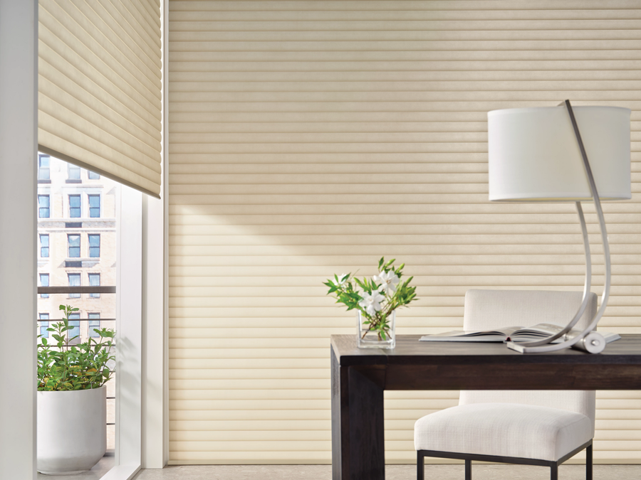 roller shades with cellular shade pockets to insulate windows